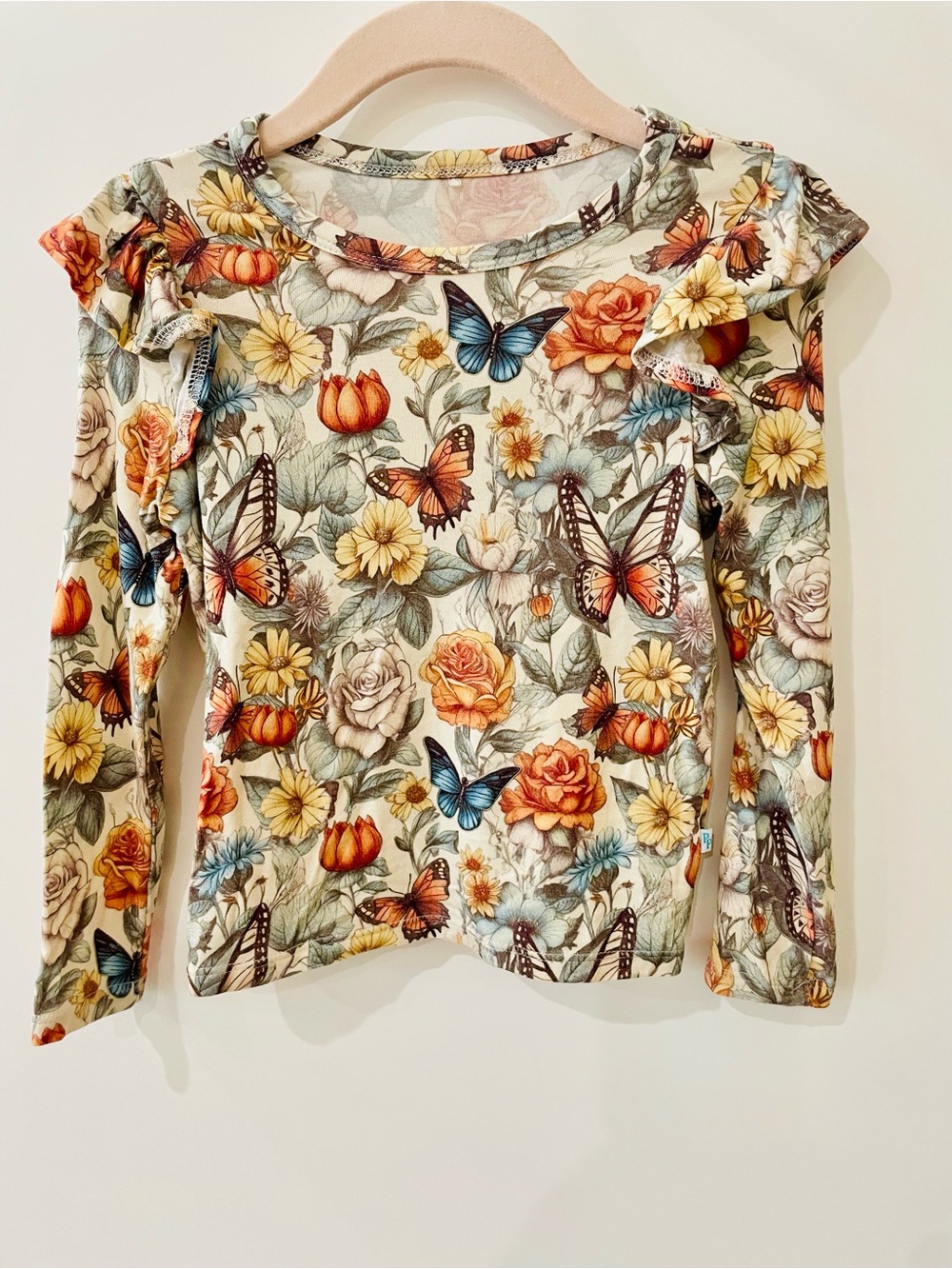 Posh Peanut Cream Floral & Butterfly Ruffle Long Sleeve Top
